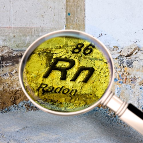 A magnifying glass held up to a home's foundation. Inside the magnifying glass is the periodic table information for radon.